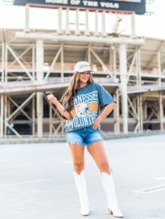 Stand out with this University of Tennessee Oversized All-Over Mini Rhinestone Tee! Featuring an all over rhinestone design of the Tennessee Volunteers helmet, this graphic tee is perfect for any fan looking to add some sparkle to their game day outfit. Game on! Summer Fan Gear Graphic Tee, Summer Fan Gear Graphic Tee Tops, Summer Graphic Tee Tops For Fans, Trucker Hat Fashion, Rhinestone Tees, Gameday Dress, Game Day Outfit, University Of Tennessee, Tennessee Volunteers