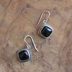 Fabulous, new Black Agate drop earrings -- new at LBJ -- but soon to be a favorite! And we couldn't love it more than here in this fabulous, Black Agate.  Modern and traditional at the same time! Minimal Design. All .925 Sterling Silver  -- oxidized, sanded, and burnished to the perfect finish. Easy on and squeeze although they will come with a rubber stopper. 12mm Cushion Cut Black Agate .925 Sterling Silver. All traditional silversmithing is done in our Baltimore, MD Studio. A powerful protect Polished Onyx Earrings For Gift, Classic Onyx Earrings Gift, Everyday Black Sterling Silver Earrings, Pink Opal Ring, Sterling Silver Earrings Handmade, Black Onyx Earrings, Pink Studs, Rose Quartz Earrings, Jasper Earrings