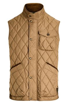 "Find RALPH LAUREN Beaton Quilted Vest on Editorialist. The between-season looks far more polished with a low-profile quilted vest popped with plenty of pocket space and shaped with snapped tabs at the waist. 27 1/2\" length (size Medium) Front zip closure with snap storm placket Stand collar Chest button-flap patch pocket; front patch pocket Adjustable snap side tabs Lined, with 96% recycled polyester, 4% polyester fill 100% recycled polyester Machine wash, tumble dry Imported" Sleeveless Outerwear With Patch Pockets For Fall, Sleeveless Fall Outerwear With Patch Pockets, Classic Sleeveless Outerwear For Outdoor, Quilted Sleeveless Vest For Workwear, Quilted Sleeveless Workwear Vest, Classic Winter Vest With Snap Buttons, Polo Vest, Honey Brown, Quilted Vest