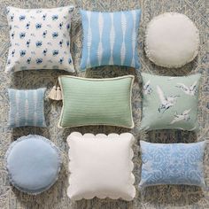 pillows and cushions laid out on the floor