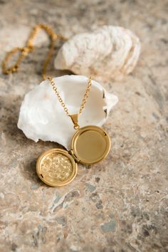 Our Lyon Locket is filled with memories and opens up to hold a picture of a loved one. PRODUCT DETAILS 18K Gold Plated Stainless Steel locket opens up Nickel free chain length: 50cm (19.5") pendant size: 2.8cm (1") CARE For the longest shine avoid contact with water, perfume, moisturizer and hairspray. We recommend you remove your jewelry when showering, exercising, at the beach, or swimming in chlorinated water. All pieces featuring natural gemstones are very precious and need to be treated wit Silver Medallion Necklace For Anniversary, Gold Plated Pendant Locket Necklace For Weddings, Gold-plated Tarnish-resistant Locket Necklace As Gift, Gold Plated Tarnish Resistant Pendant Locket Necklace, Gold Plated Tarnish Resistant Locket Pendant Necklace, Gold Plated Tarnish Resistant Locket Necklace As Gift, Gold Plated Tarnish Resistant Locket Necklace, Silver Gold-plated Locket Necklace, Gold Tarnish-resistant Locket Necklace Gift