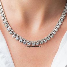 4mm Round Cut Moissanite Diamond Necklace, Pretty Tennis Necklace, 14k White Gold Designer Customised Wedding Necklace, Anniversary Gift  ✹✹𝐖𝐞𝐥𝐜𝐨𝐦𝐞 𝐭𝐨 𝐂𝐫𝐚𝐳𝐲𝐃𝐢𝐚𝐦𝐨𝐧𝐝𝐬𝐂𝐨✹✹ Detail about stones Moissanite & Simulated Stone: ----------------------------- Stone Shape: Round Cut Stone Size: 4.50 mm, 2.50 mm, 1.50 mm  Weight: 61.50 TCW (Approx.) Color: Colorless Cut: Excellent Clarity: VVS ★ 𝑰𝒕𝒆𝒎 𝑫𝒆𝒕𝒂𝒊𝒍𝒔:- ☛ Metal Purity: Solid Gold (10KT, 14KT, 18KT); Silver(925 Sterling, 935 Argentium), 950 Platinum ☛ Metal Tone: Yellow, White, Rose ☛ Stamp/Hallmark: Yes ★ 𝑪𝒖𝒔𝒕𝒐𝒎𝒊𝒛𝒂𝒕𝒊𝒐𝒏:- ☛ Customized Design Jewelry. ☛ All cuts which you dream to make with moissanite. ☛ Updating every step of your ordered jewelry(Loose Stone, CAD & Making Process) ☛ All listed items Bridal White Gold Diamond Necklace In Pear Shape, Formal Diamond White Bridal Necklace With Prong Setting, Pear-shaped Diamond Bridal Necklace In White Gold, Pear-shaped Brilliant Cut Diamond Bridal Necklace, Formal Pear-shaped Brilliant Cut Bridal Necklace, Formal Brilliant Cut Pear-shaped Jewelry, Wedding Jewelry, Pear-shaped Brilliant Cut, Luxury Pear-shaped Diamond Necklace For Wedding, Exquisite Diamond Necklace For Anniversary