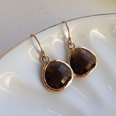 READY TO SHIP! Smoky Brown Earrings Gold Plated - Bridesmaid Earrings - Wedding Earrings - Bridesmaid Jewelry The smoky quartz/brown earrings are 13mm with 5mm at the thickest part. They are 16k gold plated glass gems. The earwires are 14k gold filled. The length of the earrings is approximately 1 inch. You are sure to stand out in these beautiful earrings! All of my items include a gift box for easy gift-giving for your friends or for yourself! I love custom orders! If you are a looking for a b Brown Earrings, Brown Jewelry, Glass Gems, Celestial Jewelry, Zodiac Necklaces, Zodiac Jewelry, Coin Necklace, Bridesmaid Earrings, Bridesmaid Jewelry