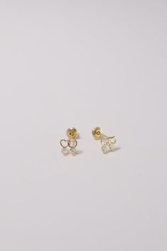 PLX438 Our XXS Double Heart CZ Screw Back Earrings are meticulously handcrafted in Korea. They beautifully blend classic and contemporary style, making them a unique piece of jewelry. Made from 14K solid gold, studded with cubic zirconia in a double heart design, these earrings not only offer durability but also emanate a sophisticated charm. Their screw back design ensures a secure and comfortable fit, perfect for adding a delicate and elegant touch to your everyday look or for special occasion Gold Cubic Zirconia Heart Earrings In Dainty Style, Gold Dainty Heart Earrings With Cubic Zirconia, Dainty Gold Heart Earrings With Cubic Zirconia, Gold Heart Earrings With Diamond Accents For Gift, Elegant White 14k Gold Heart Earrings, 14k Gold White Heart Earrings For Gift, White 14k Gold Heart Earrings Gift, Korea Town, Double Up