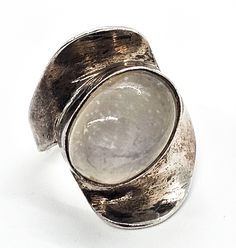 Modernist Abstract flashy blue moonstone large sterling silver ring. Good used condition with little to no signs of normal wear. Great vintage patina. Ring has been left in as found condition. Light blue purple flash over the top of the moonstone. Solid sterling silver construction. Acid tests positive for sterling silver. Ring measures size 5. Purple Flash, Blue Moonstone, Over The Top, Blue Purple, Sterling Silver Ring, Moonstone, Silver Ring, Sterling Silver Rings, Blue And Purple