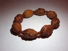 "This bracelet is made with hand carved seed beads representing taoist figures and animals. On the back of one seed it is write probably the artist signature. Period: half 20th century. Back to \"Bracelets\" section: https: https://www.etsy.com/shop/ArteOrientaleBologna?ref=hdr_shop_menu&section_id=18796442 Back to my shop: https://www.etsy.com/shop/ArteOrientaleBologna?ref=hdr_shop_menu" Spiritual Carved Beaded Bracelets, Spiritual Carved Beaded Bracelets, Adjustable, Adjustable Carved Beaded Spiritual Bracelets, Adjustable Carved Beaded Bracelets For Spiritual Style, Spiritual Carved Adjustable Bracelets, Spiritual Adjustable Carved Bracelets, Traditional Carved Beaded Bracelets As Gift, Traditional Carved Beaded Bracelets For Gift, Adjustable Carved Bracelets With Round Beads