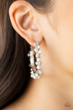 A bubbly array of classic white rhinestones and glassy white rhinestones are encrusted along the front of a silver hoop, creating an elegantly effervescent look. Earring attaches to a standard post fitting. Hoop measures approximately 1 1/2" in diameter.

Sold as one pair of hoop earrings. Paparazzi Accessories Jewelry, White Hoop Earrings, Life Of The Party, Rhinestone Ring, Party Earrings, Pearl Hoop Earrings, Paparazzi Accessories, White Necklace, White Rhinestone