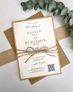 the wedding stationery is tied up with twine