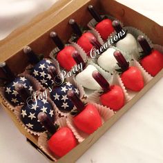 a box filled with red, white and blue cupcakes