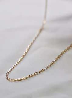 A delicate version of one of our most sought after styles, this Miniature Paperclip Chain can be worn everyday with ease. This barely there chain is great for layering. Materials: 24kt gold plated brass, gold-filled lobster closure and chain extender Length: 15"-17" adjustable SKU: CN1439 Bachelorette Party Dress, Maxi Dress Wedding, Chain Extenders, 24kt Gold, Brass Gold, Silver Dress, Gold Dress, New Arrival Dress, Staple Pieces