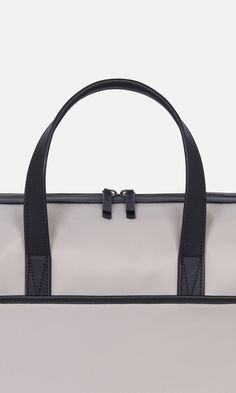 Designed to be the perfect piece of hand luggage, our overnight bag will sit neatly under the seat in front of you on a plane, and has a back sleeve to slot over a suitcase handle. It doubles up as an ideal gym bag and comes with a detachable shoulder strap (you'll find this inside a pocket on arrival). Inside, there are plenty of slip pockets including one for a laptop. This holdall is finished with premium leather details. Durable nylon Water-resistant Fits a laptop up to 13” Dimensions 16.34 Beige Lifestyle, Air Asia, Suitcase Handle, Hardside Luggage, Bag For Travel, Hand Luggage, A Plane, Overnight Bag, Laptop Pocket