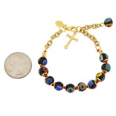 If you are looking for jewelry that is not just beautiful and elegant, but also meaningful and unique, don't look any further than this Murano Glass Millefiori Rosary Bracelet. Centuries-old Murano glass technique perfected by Italian master craftsmen of Venice is used to create a colorful mosaic effect, which is a perfect reminder of Italy. The bracelet features a beautiful gold-plated crucifix and a high-quality gold-plated chain with an extender to fit any wrist size. Classic and timeless, th Symbolic Multicolor Round Beads Jewelry, Symbolic Multicolor Beaded Jewelry, Metal Beaded 8mm Bracelet, Metal Bracelet With 8mm Beads, Metal Bead Bracelet 8mm, Spiritual Glass Bracelet Jewelry, Multicolor Spiritual Jewelry With Adjustable Chain, Adjustable Multicolor Nickel-free Jewelry, Spiritual Multicolor Jewelry With Adjustable Chain