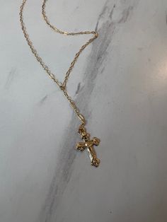 Elevate your style with our Crucifix necklace, featuring a delicate sequin chain perfect for layering. Express your faith with elegance in a subtle yet powerful way. 14K Chain is 18" long with a 2" drop Dainty Crucifix Necklace With Adjustable Chain, 14k Gold Filled Cross Necklace With Delicate Chain, Dainty Gold Chain Lariat Necklace, Dainty Lariat Necklace With Gold Chain, Dainty Gold Lariat Necklace, Crucifix Necklace, French Collection, Bar Jewelry, Forever Jewelry