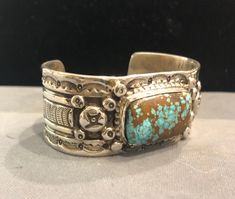 Artisan Engraved Turquoise Ring Collectible, Artisan Etched Jewelry For Collectors, Western Style Stamped Turquoise Ring Gift, Turquoise Stamped Cuff Bracelet Collectible, Traditional Stamped Turquoise Jewelry, Southwestern Stamped Turquoise Ring Gift, Southwestern Style Stamped Turquoise Ring As Gift, Artisan Stamped Turquoise Ring, Unique Stamped Turquoise Jewelry