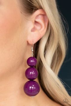 Oversized purple beads gradually increase in size as they drip from the ear, coalescing into a colorful statement piece. Earring attaches to a standard fishhook fitting.

Sold as one pair of earrings. Turquoise Stone Jewelry, Paparazzi Accessories Jewelry, Purple Beads, Material World, Purple Earrings, Statement Drop Earrings, The Ear, Fish Hook Earrings, Paparazzi Accessories