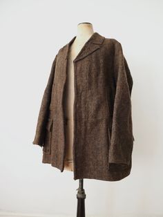 "1930s Romanian brown wool jacket. This is a piece of traditional folk clothing sources from the Transylvania area of Romania. It has really interesting horizontal pockets on the centre front and then two lower pockets with shaped flap covers. The back is shaped across the shoulders with a back tab panel.  Measures: 22\" underarm to underarm, 18\" across the shoulders, 24\" sleeves, 31\" long from top of shoulder to hem. Condition: good overall. There is some damage and a few holes. Mainly on th Brown Long Sleeve Tweed Jacket With Pockets, Vintage Brown Wool Outerwear, Brown Tweed Jacket With Patch Pockets For Work, Vintage Tweed Jacket With Lapel Collar And Pockets, Classic Brown Tweed Jacket With Pockets, Vintage Brown Long Sleeve Tweed Jacket, Brown Wool Sport Coat, Brown Tweed Jacket With Patch Pockets For Fall, Brown Tweed Jacket With Pockets For Winter