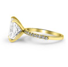 a yellow gold engagement ring with a white diamond