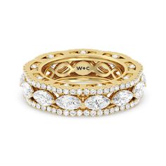 an 18k yellow gold ring set with three rows of round brilliant cut diamonds on each band