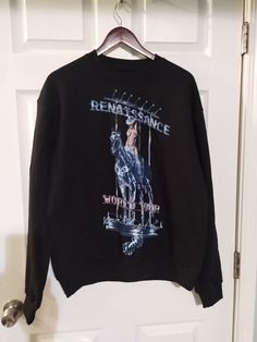 Show your love for Beyoncé with this official Renaissance World Tour merch billboard sweatshirt. The classic fit, crew neck sweatshirt is made of 100% cotton and features a graphic print of the Renaissance World Tour logo. The heavyweight and tagless design make it perfect for all seasons, whether you're running errands or attending a concert. The sweatshirt is machine washable and comes in size M. The black sweatshirt with solid pattern is perfect for unisex adults who want to show their love for Beyoncé and the Renaissance World Tour. The long sleeve sweatshirt with pullover closure and crew neck is an ideal addition to any activewear collection. Get your hands on this TX-themed sweatshirt, perfect for fans of Beyoncé and music in general. Measurements Pit to pit 254 Neck to bottom 28 Ch Amazon Sweatshirt, Pet Friendly House, Tour Merch, Black Sweatshirt, Solid Pattern, World Tour, Long Sleeve Sweatshirts, Beyonce, Running Errands