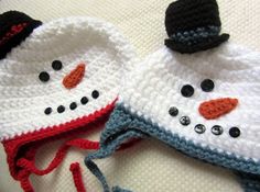 two crocheted hats with snowmen on them