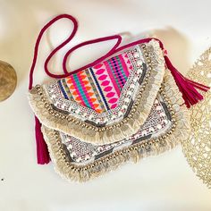 Multicoloured Beaded Indian Boho Banjara Bag- This unique and a colourful clutch combines the vibrancy of traditional Banjara artistry with contemporary design. Handcrafted with meticulous attention to detail, this clutch features intricate beadwork and coin work, making it a true work of art. Specifications: Material: High-Quality Premium Jacquard Fabric. Braided Leather( Vegan ) PU Soft Sling and tassels. Closure: Zipper with Magnetic Snap Embellishments: Coin, Beads Work and Tassels Pocket: I Boho Clutch Bag, Purse Wedding, Boho Clutch, Beads Work, Handmade Purse, Handmade Purses, Envelope Bag, Jacquard Fabric, Cotton Pads