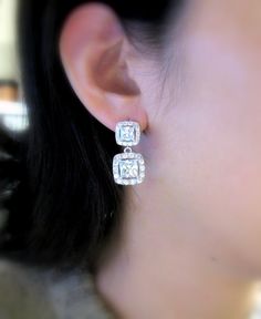 AAA cubic zirconia diamond square shape drop. Sparkling square cubic zirconia deco white gold plated metal frame post earrings.earrings have Emerald cut & Cubic Zirconia framed in micropave to look like real diamonds! Posts are sterling silver. Size: 2.7cm x 1.3cm Matching bracelet: https://www.etsy.com/listing/175833758/wedding-jewelry-bridesmaid-jewelry?ref=shop_home_active_7&ga_search_query=bracelet Matching necklace: https://www.etsy.com/listing/177502034/wedding-necklace-bridal-neck Luxury Rectangular Diamond Earrings, Luxury Square Cut Halo Jewelry, Luxury Square Cut Halo Design Jewelry, Elegant Cubic Zirconia Diamond Earrings With Halo Setting, Square Cut Fine Jewelry For Wedding, Rectangular Diamond Earrings With Accents For Formal Events, Rectangular Diamond Earrings For Formal Events, Rectangular Diamond Earrings For Formal Occasions, Square Cut Jewelry With Diamond Accents For Wedding