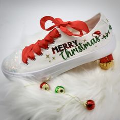 Enjoy a beautiful White Christmas with unique shoes. Bedazzled with sequins, rhinestones, glitter, and other beautiful details. The toe top is covered with a resin mixed with white flakes of glitter, simulating the concept of snow. 🌟Includes🌟 - Pick shoelace colors.  - The toe top is covered with bright green and red rhinestones. - On the sides of the shoe, the Christmas theme is printed in glitter color. 🧡You will receive🧡 - One pair of sneaker canvas off-brand - One pair of shoelaces in si Christmas Shoes For Women, Christmas Tennis Shoes, Christmas Shoes Diy, Santa Garland, Christmas Tennis, Christmas Sneakers, Diy Christmas Canvas, Holiday Family Gifts, Custom Wedding Shoes