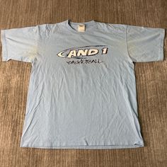 Vintage 2000s AND 1 Basketball Streetball Spell Out Sportswear Athletic Y2K Aesthetic Streetwear Blue Graphic T Shirt Large Mens Condition: Fair Used Condition = Has stains on both armpit areas due to wear and age. Measurements: Please see photos above for all measurements IF YOU BUY TWO OR MORE ITEMS USE THE CODE BUNDLE @ CHECK TO SAVE 20% WE SHIP WITHIN 24 HOURS AFTER PURCHASE! Please be aware that we do not offer free returns!! The Buyer is responsible for the cost of the return label.  Follo Blue Sportswear T-shirt For Sports Season, Blue Cotton T-shirt For Workout, Blue Cotton Workout T-shirt, Blue Casual Activewear With Graphic Print, Blue Casual Activewear With Letter Print, Casual Blue Activewear With Graphic Print, Blue Sportswear T-shirt With Letter Print, Blue T-shirt With Letter Print For Workout, Blue Workout T-shirt With Letter Print