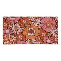 an orange and pink flower pattern on a white background