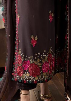 Echoes of vintage tales whisper through this dark brown masterpiece. Every thread – be it pink, maroon, or deep beige – sketches a floral fantasy, set alight by matte gold sequins. The accompanying dupatta, a promise of timeless allure. Immerse yourself in the timeless artistry of 'aari stitch' with this design and let the intricate craftsmanship adorn your style. Embroidered Front Neckline. Embroidered Front, Back, and Sleeves With Border. Embroidered Border For Chaak. Embroidered Dupatta On Ch Festive Brown Dress With Intricate Embroidery, Elegant Brown Dress With Intricate Embroidery, Elegant Brown Dress With Dupatta, Brown Wedding Dress With Intricate Embroidery, Festive Brown Dress With Resham Embroidery, Brown Festive Dress For Eid, Festive Fall Dress With Intricate Embroidery, Brown Anarkali Dress For Festive Occasions, Fitted Brown Anarkali Dress