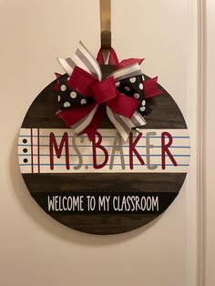 a sign that says i'm baker welcome to my classroom hanging on the door