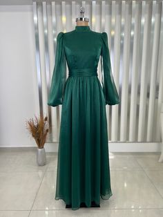 Made from 100% organza chiffon fabric.  product weight is 550 grams.  It is a lined dress.  It is 152 centimeters long. Green Organza Evening Dress For Wedding, Green Organza Gown For Banquet, Green Organza Gown For Banquets, Green Chiffon Evening Dress, Organza Dress With Sheer Long Sleeves, Green Organza Evening Dress For Banquet, Long Sleeve Chiffon Dress For Wedding, Long Sleeve Organza Dress With Sheer Sleeves, Green Floor-length Organza Evening Dress