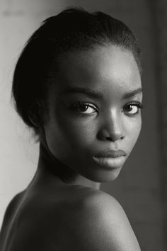 a black and white photo of a woman's face