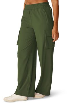 Wide legs add to the off-duty look of relaxed pants made with a comfortable elastic waist and deep cargo pockets to carry your essentials. 31" inseam; 22 1/2" leg opening; 9 3/4" front rise; 13 1/2" back rise (size Medium) Elastic/drawstring waist Front zip pockets; cargo flap-patch pockets 100% polyester Machine wash, tumble dry Imported Relaxed Pants, Leaf Green, Beyond Yoga, Wide Legs, Palm Leaf, City Chic, Off Duty, Drawstring Waist, Cargo Pants