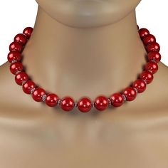 This is part of Chairish’s Costume Jewelry assortment.  Festive 18-Inch Holiday Red Pearl Necklace with Silver Accents – A Perfect Seasonal Statement  Celebrate the holidays in style with this stunning 18-inch manmade pearl necklace. Featuring luscious 14mm red pearls, this piece radiates festive charm and elegance. The pearls are beautifully accented with fluted silver-tone spacers, adding a touch of sophistication and sparkle to the design.  Secured with a sleek silver hook and eye clasp, this Elegant Red Beaded Necklace For Christmas, Elegant Red Pearl Necklace For Formal Occasions, Red Pearl Necklaces For Party, Party Red Pearl Necklaces, Elegant Single Strand Red Pearl Necklace, Elegant Red Single Strand Pearl Necklace, Purple Bead Necklace, Brown Beaded Necklace, White Beaded Necklaces