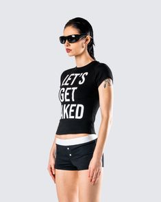 Let’s get naked 🖤 Let them know the vibes in this black graphic top. Made from stretch cotton jersey fabric, this piece won't be staying on for too long 😜 Y2k Crew Neck T-shirt For Night Out, Edgy Fitted T-shirt With Text Print, Fitted Black T-shirt For Loungewear, Trendy Stretch T-shirt With Slogan, Stretch Crop Top With Letter Print For Night Out, Stretch Letter Print Crop Top For Night Out, Edgy Graphic Tops For Summer, Edgy Summer Tops With Graphic Design, Edgy Stretch Crop Top With Letter Print