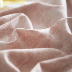 a close up view of a pink fabric