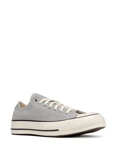 Find CONVERSE Chuck 70 Sneakers on Editorialist. medium grey canvas front lace-up fastening logo patch to the rear eyelet detailing rubber toecap round toe branded insole flat rubber sole When buying this unisex item, keep in mind that it is graded in standard men's sizing. We've partnered with Good On You — an independent agency that rates how brands perform in relation to their impact on the planet, people and animals, with a multi-criteria rating simplified to a five points scale. In order to be awarded our conscious label, larger brands need to score a minimum of four out of five ('Good'), while smaller brands must score at least three out of five ('It's A Start'). This item comes from a brand rated three out of five ('It's A Start') by Good on You at the time it was added on FARFETCH. Gray Lace-up Canvas Shoes With Rubber Sole, Gray Canvas Shoes With Vulcanized Sole And Round Toe, Gray Canvas Shoes With Vulcanized Sole, Converse Low-top Textile Sneakers, Low-top Canvas Converse Shoes, Converse Textile Canvas Shoes With Rubber Sole, Converse Canvas Sneakers With Gum Sole, Converse Canvas Shoes With Rubber Sole, Converse Canvas Shoes With Laces