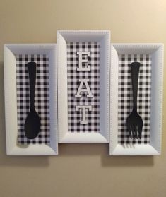 two black and white framed pictures with utensils in them that say eat on the wall