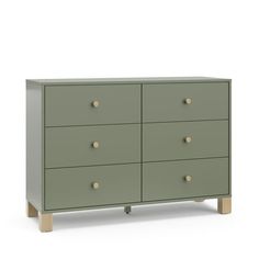 a green dresser with four drawers and two wooden legs on the bottom, in front of a white background