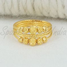 Inspired by the timeless beauty of traditional Indian artistry, this 22k gold ring embodies grace and sophistication. Handcrafted with intricate detailing, the design showcases a blend of classic motifs and contemporary flair. Perfect for marking special occasions or adding a touch of luxury to your everyday look, this ring celebrates the richness of Indian heritage with every gleaming curve. 22k gold ring handmade jewelry made in India Metal is Real Gold Not Filled or Not Gold Plated Metal - Ye Gold Ring Indian, 22k Gold Ring, Beads Ring, Ring Indian, Indian Heritage, Gift Jewelry, Traditional Indian, Beaded Rings, 22k Gold