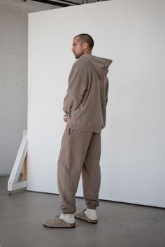 A staple in every wardrobe. The Core Sweatpant is made of 12 oz cotton with a vintage-inspired, baggy silhouette. Includes elasticized hem cuffs, drawstring waistband, and side pockets. Pair it with one of our Core sweatshirts to complete your matching lounge set. 100% ORGANIC COTTON 12 OZ BRUSHED TERRY STANDARD FIT HIGH RISE GARMENT WASHED Oversized Cotton Sweatpants For Fall, Brown Relaxed Fit Joggers For Streetwear, Brown Relaxed Fit Sweatpants For Winter, Cotton Sweatpants With Ribbed Cuffs For Casual Wear, Cotton Sweatpants With Ribbed Cuffs For Elevated Casual Wear, Winter Brown Relaxed Fit Sweatpants, Oversized Cotton Joggers For Fall, Oversized Sweatpants With Pockets And Straight Hem, Cotton Tapered Leg Sweats For Fall