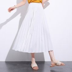 Exude elegance and class in our Solid Pleated Ankle Length Skirt. Featuring a long fit and elasticated waistband, this skirt is sure to keep you feeling comfortable and looking stylish all day long. Perfect for everyday wear, this versatile piece may be paired with a sweater or blouse for an effortlessly chic look to wear for casual days out or informal settings. Casual Long Stretch Skirt, Non-stretch Long Skirt For Spring, White Non-stretch Lined Skirt, Spring Non-stretch Long Skirt, White Non-stretch Pleated Bottoms, Non-stretch Summer Lined Skirt, White Non-stretch Pleated Skirt For Spring, Non-stretch Flared Skirt For Summer, Ankle-length Solid Lined Skirt