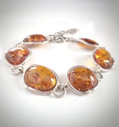 Long silver natural amber link bracelet Elegant Amber Sterling Silver Bracelets, Elegant Amber Bracelets With Polished Finish, Elegant Amber Bracelet With Polished Finish, Elegant Amber Sterling Silver Bracelet, Elegant Oval Amber Bracelets, Amber Earrings, Amber Bracelet, Amber Stone, Amber Jewelry