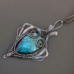 Gemstone : Labradorite/  Copper Pendent Metal : Copper Pendant Height : 10 CM Beautiful Wire Wrap Pendent  This calming Larimar  stone is believed to be useful in strengthening bones, teeth, nails, and alleviating high stress levels. What is this? Because of its ability to improve intuition, prehnite stones are considered beneficial for people who work in environments that require a high level of attention to detail. Teeth Nails, Gardening Gifts, Copper Wire Jewelry, Necklace Birthstone, Larimar Stone, Handmade Jewelry Necklace, Copper Pendant, Wire Weaving, Copper Pendants