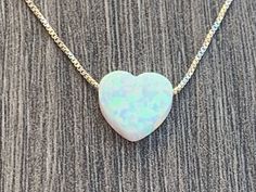 "Opal Heart Charm Necklace ** Please measure your neck before ordering (standard size is 16-18) ** 13\" & 14\" chains can not be returned Necklace Details: Sterling Silver 0.7mm Box Chain 14kt Gold Filled 0.7mm Box Chain Charm Details - Lab Created OPAL Opal Heart Charm - 10mm (Light Blue, Blue or White ) 100% satisfaction guaranteed . If for any reason you are not happy with this product you may ship it back. See other ideas: https://www.etsy.com/listing/652743766/opal-heartbeat-sterling-si White Heart Pendant Jewelry For Birthday Gift, White Heart Cut Jewelry As Gift, White Heart Cut Jewelry For Gift, White Heart Cut Jewelry Gift, White Heart Cut Jewelry For Anniversary Gift, White Heart Cut Jewelry For Anniversary, Great Graduation Gifts, Heart Charm Necklace, Gift Teacher