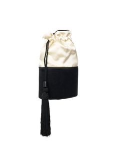 a black and white bag with a tassel