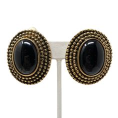 "Gorgeous vintage statement earrings! Bronze colored metal with black glass cabochons Clip ons Circa 1980s New old stock Never worn Measure 1 5/8\" long & 1 3/8\" wide Great vintage condition. Please enjoy! Thanks for visiting ♥" Vintage Black Metal Clip-on Earrings, Black Cabochon Earrings For Evening, Evening Black Cabochon Earrings, Vintage Black Metal Earrings, Black Vintage Metal Earrings, Black Retro Clip-on Jewelry, Black Vintage Clip-on Earrings, Black Metal Costume Jewelry Earrings, Vintage Black Enamel Clip-on Earrings