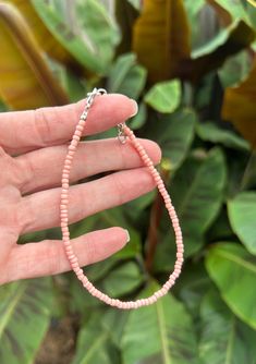 Salmon pink beading and she's a beauty!  This anklet is dainty but solid using 3mm beads.  Our anklets are made to last using premium beading wire and beads.  We have many colors to choose from so please check out our other listings as well! Choose your size and we will get it made and shipped out to you the same day or next.  Each anklet comes with a bit of chain extension to give you more room at times if you need it or so you can stack with other anklets! Your new piece will come in our own Son Shine Shells packaging and in a cute little mesh bag.  Ready for gift giving or to bring a smile to your own face! Affordable Adjustable Pink Anklet, Cheap Pink Beaded Anklets, Cheap Pink Round Beads Anklets, Salmon Jewelry, Summer Anklets, Beaded Ankle, Beaded Anklet, Beach Anklets, Women Anklets