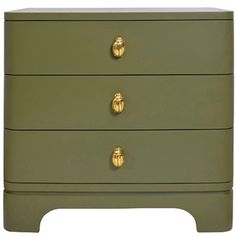 an olive green chest of drawers with gold knobs on the top and bottom drawer